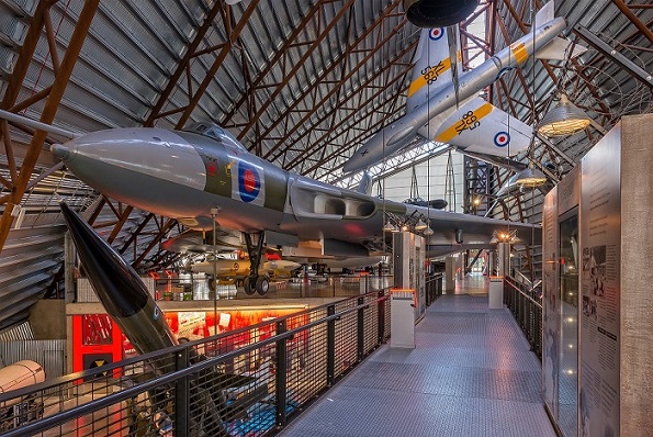 Hanger at RAF Cosford Museum with several planes hanging from the ceiling 