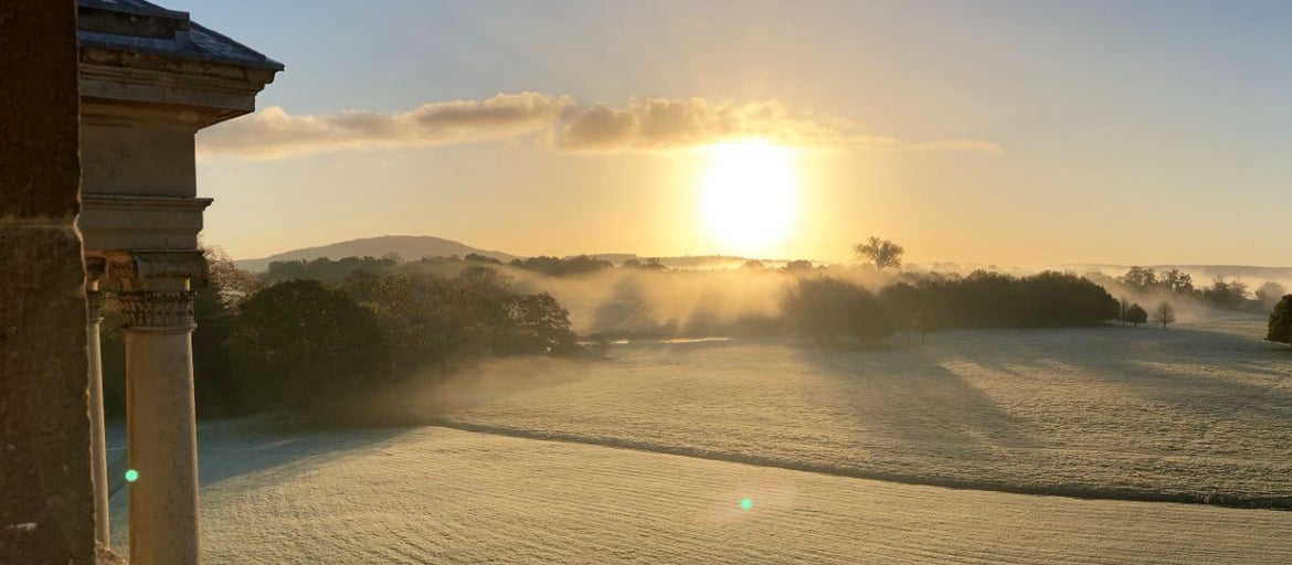 Frosty, misty morning over the grounds of Attingham park